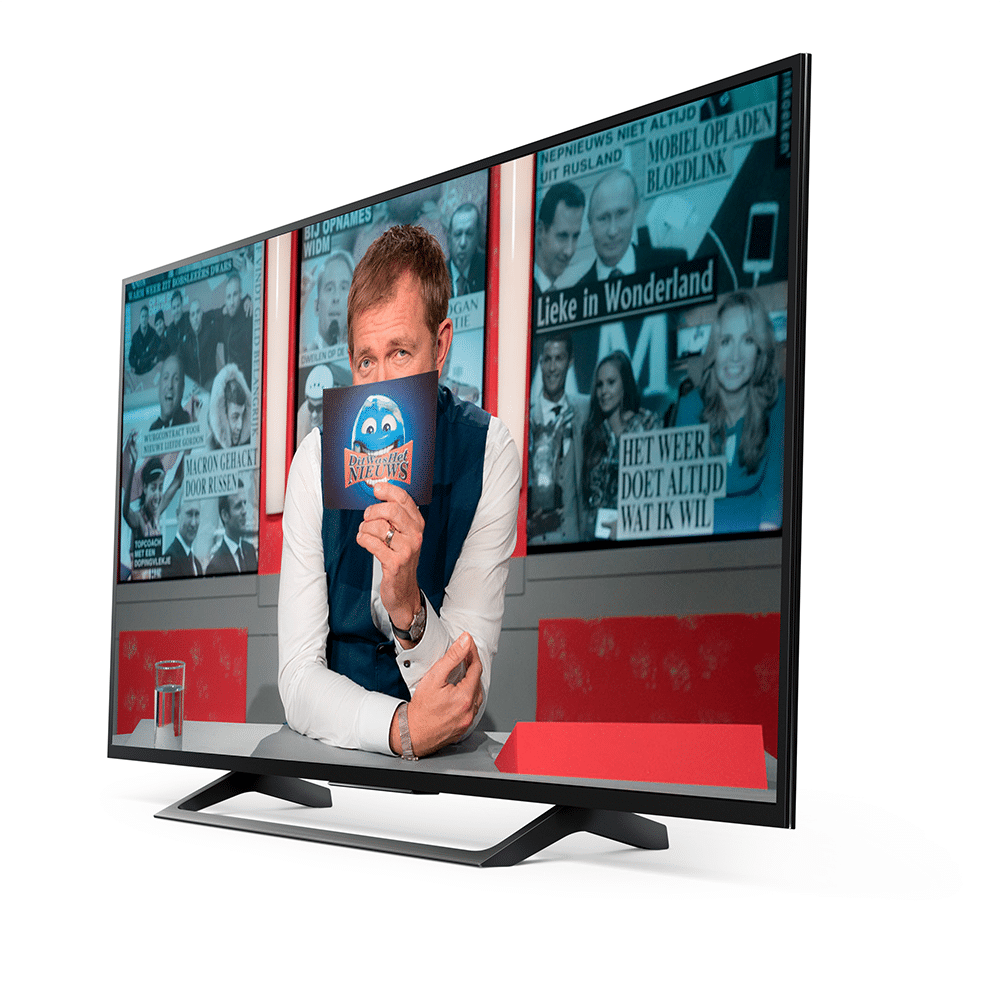 Modern talk show host from dit was het nieuws engaging viewers with news and discussions on a sleek television.